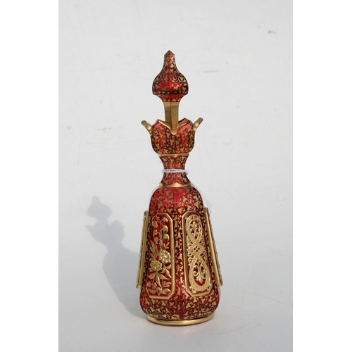 35 - A fine quality 19th century Bohemian cranberry glass scent bottle with gilded overlay decoration, 20... 