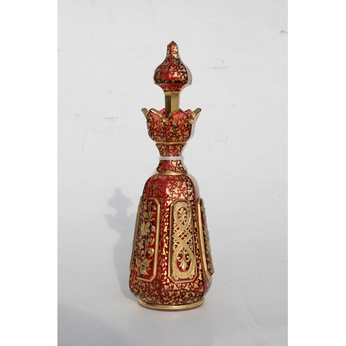 35 - A fine quality 19th century Bohemian cranberry glass scent bottle with gilded overlay decoration, 20... 