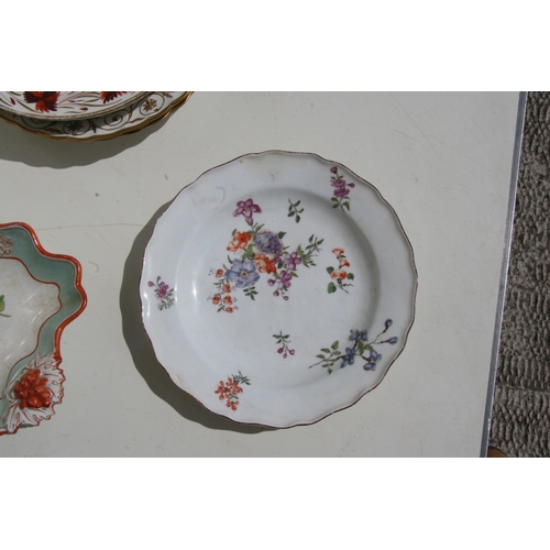 59 - A pair of Crown Derby porcelain plates, each with landscape panels within a gilded border, 23cms (9i... 