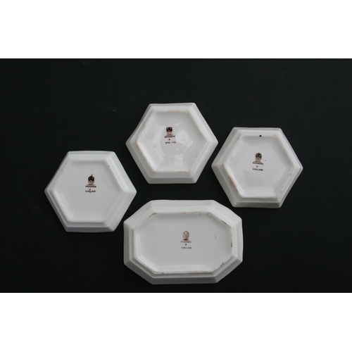 63 - A group of four hand painted Wedgwood pin dishes, the largest, 10cm (4ins) wide (4).