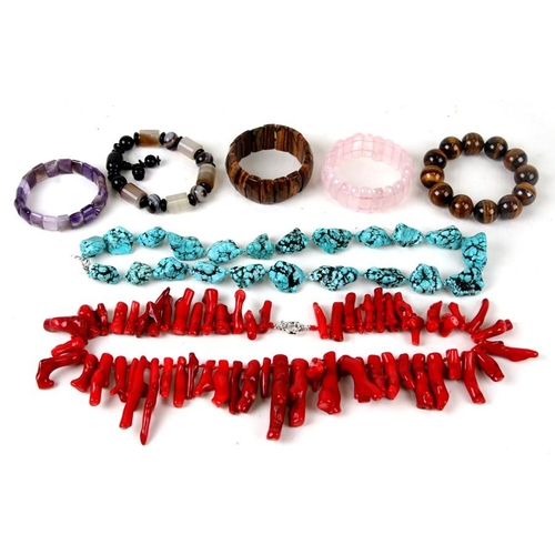 1011 - A quantity of costume jewellery to include a coral branch necklace and tiger's eye bead bracelet.