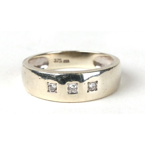 1027 - A 9ct white gold gypsy style ring set with three diamonds. Approx Uk size O  3.1g