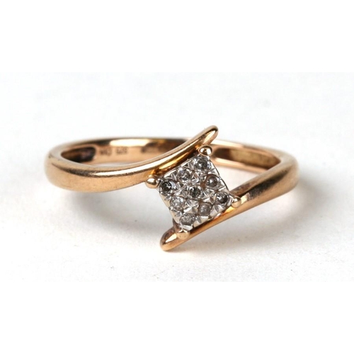 1029 - A 9ct gold diamond ring. Approx UK size N  1.8