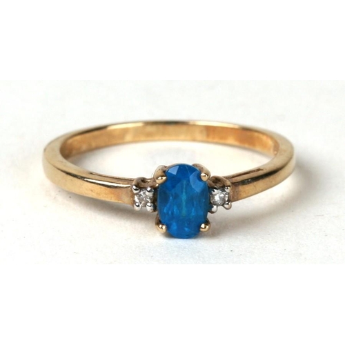 1030 - A 9ct gold ring set with blue stone and diamond set shoulders. Approx UK size N  1.5g