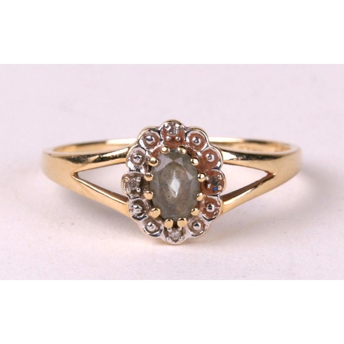 1031 - A 9ct gold quartz and diamond cluster ring. Approx UK size T  1.9g