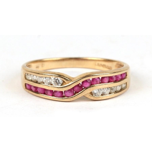 1039 - A 9ct gold ring set with cross-over panels of pink and white stones, approx UK size 'P'.