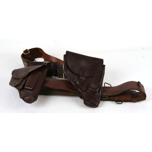 1065 - Two brown leather belts and holsters, possibly for the P64 Makarov pistol