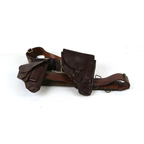 1065 - Two brown leather belts and holsters, possibly for the P64 Makarov pistol