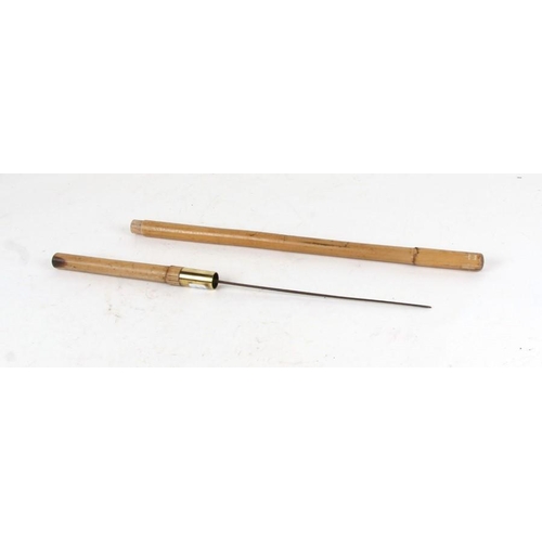 1069 - A cane military swagger stick with concealed square section Stiletto Dagger . Overall length 60.5cms... 