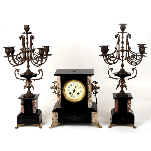 122 - A Victorian black slate clock garniture