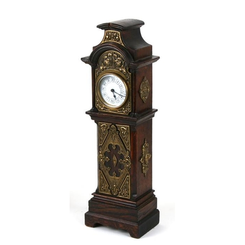 123 - A 19th century style oak miniature longcase clock, the hood and trunk with applied brass decoration,... 