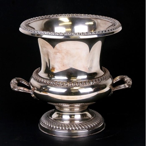 134 - A silver plated two-handled ice bucket, 25cms (9.75ins) high; together with a large silver plated tr... 