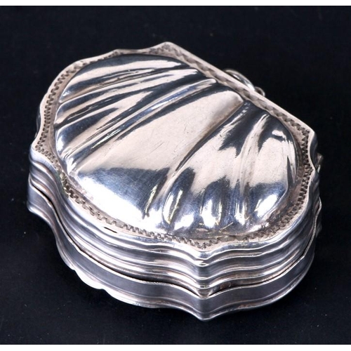 182 - A continental silver snuff box with shell back and ornate figural scene to the front. 6cm ( 2.25 ins... 