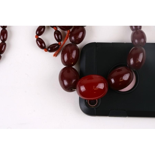 229 - A quantity of cherry amber bead necklaces to include four long necklaces, four faceted cherry amber ... 