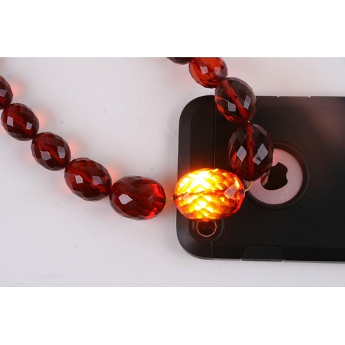 229 - A quantity of cherry amber bead necklaces to include four long necklaces, four faceted cherry amber ... 