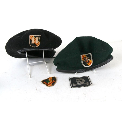 276 - Two Vietnam war period berets and cloth badges, to include Special Forces.