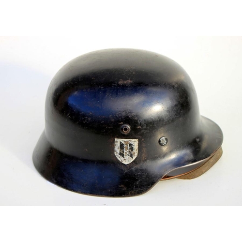 311 - A WW2 M35 Third Reich helmet with liner and chin strap. Marked inside the helmet N.S.66 and D. 12. T... 