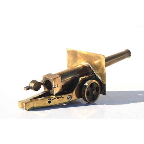 321 - A detailed WW1 trench art brass breechloading Cannon with opening breech and rotating wheels. Barrel... 