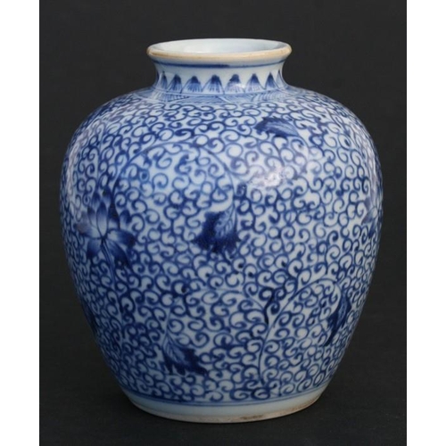 372 - A Chinese blue & white vase decorated with flowers and foliate scrolls, 13cms (5ins) high; together ... 