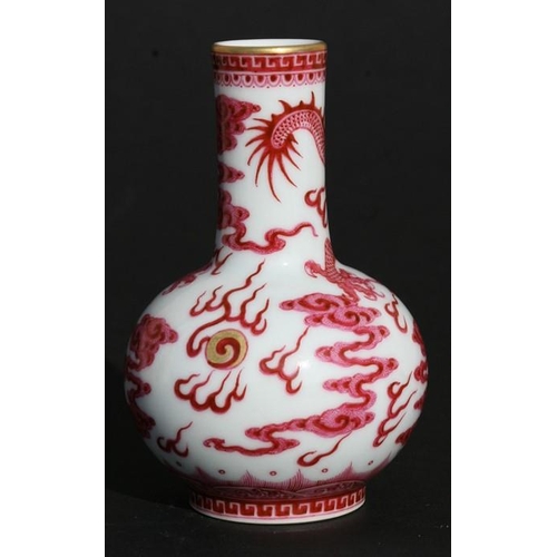 390 - A Chinese porcelain bottle vase decorated pink dragons amongst clouds chasing a flaming pearl, blue ... 