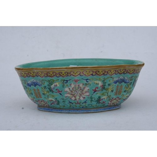 394 - A Chinese famille rose shaped oval bowl decorated with flowers and characters on a turquoise ground,... 