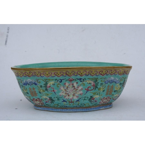 394 - A Chinese famille rose shaped oval bowl decorated with flowers and characters on a turquoise ground,... 