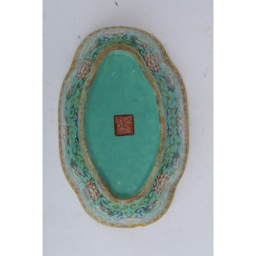 394 - A Chinese famille rose shaped oval bowl decorated with flowers and characters on a turquoise ground,... 