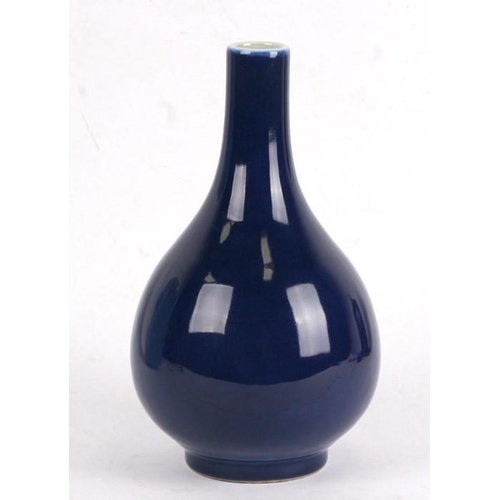 395 - A Chinese blue glazed bottle vase with six character blue mark to the underside, 24cms (9.5ins) high... 