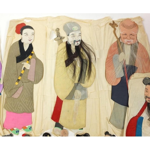 404 - A group of early 20th century Chinese silk and hand painted paper figures