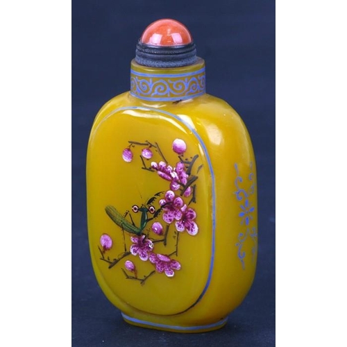 412 - A Chinese Peking glass snuff bottle decorated with insects and flowers, four character mark to the u... 