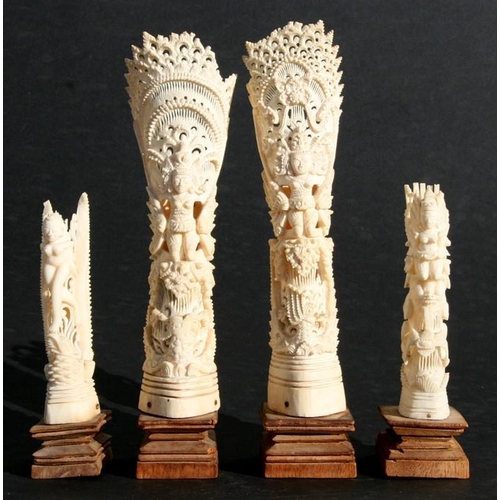 428 - A pair of Indonesian carved bone vases, 24cms (9.5ins) high; together with a smaller similar, 15cms ... 