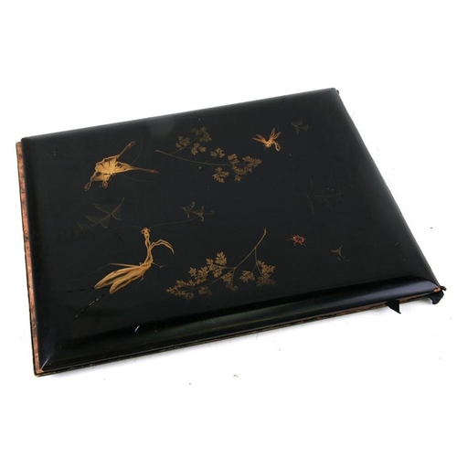 441 - A late 19th century Japanese Meiji period lacquered album cover, the interior with marbled boards an... 