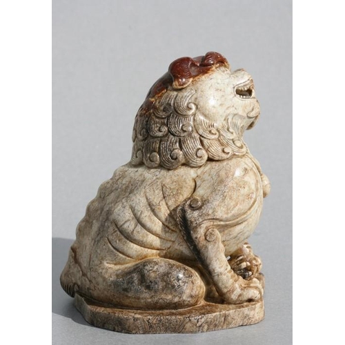 458 - A Chinese figured jade / hardstone temple lion, 10cms (4ins) high.