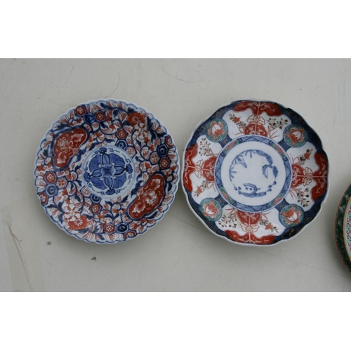 481 - A Chinese famille rose plate decorated with flowers, six character blue mark to the underside, 21.5c... 