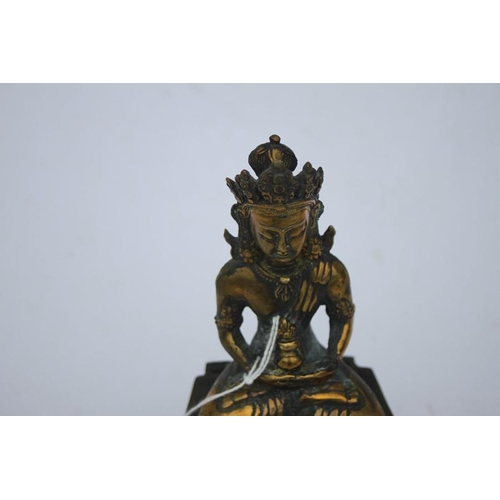 496 - A Chinese bronze figure of a seated Buddha in meditation, 16cms (6.25ins) high.