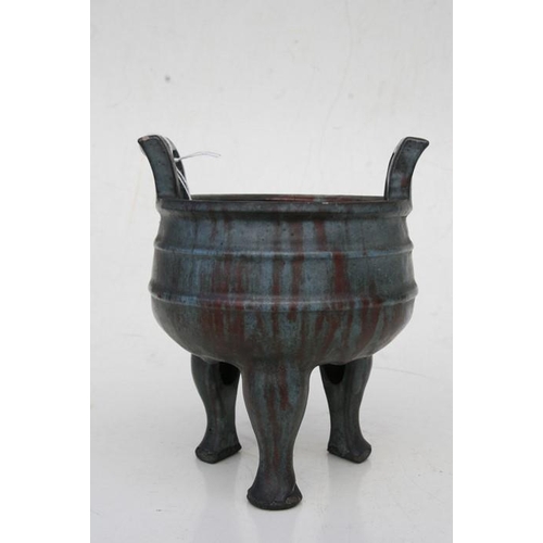 535 - A Chinese two-handled pottery censer on three legs, multi-character seal mark to the underside, 20cm... 