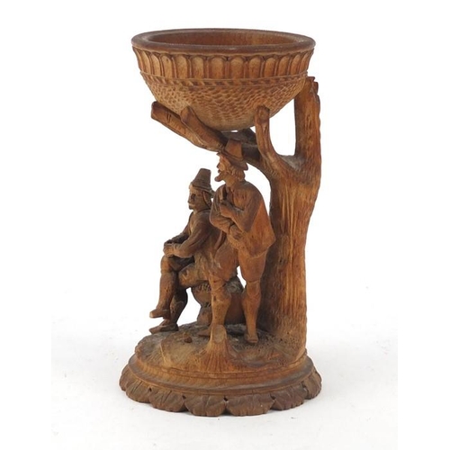 571 - 19th century Continental bowl on figural stand depicting two peasants beneath a tree, 12cm (4.75 ins... 