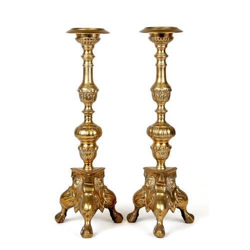 597 - A pair of brass pricket candlesticks, 41cms (16ins) high.