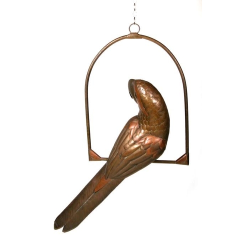 634 - Sergio Bustamante - a brass and copper parrot in an arched perch, with black glass eyes, the parrot ... 