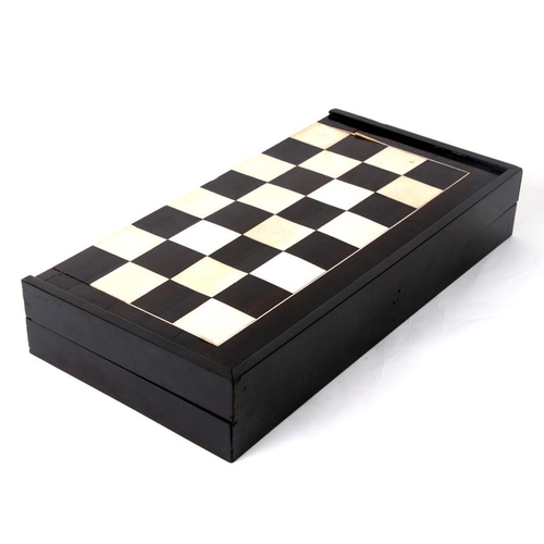 650 - An ebony and ivory folding backgammon/ chess board. 46cm (18ins) wide