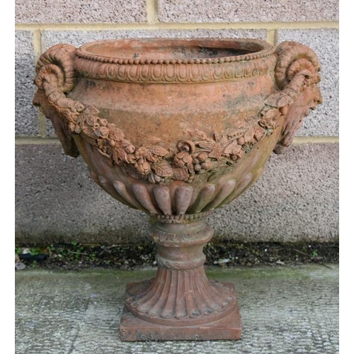 7 - A terracotta urn of classical form, approximately 46cms (18ins) diameter.