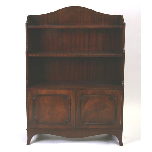 766 - A mahogany waterfall bookcase with cupboards. 84cm (33 ins) wide