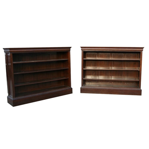 782 - A pair of figured walnut open bookcases with three adjustable shelves, on plinth bases, 160cms (63in... 