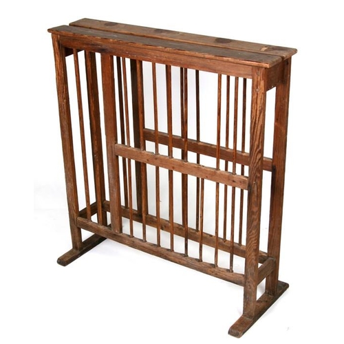 785 - A pine plate rack with spindle divisions, 71cms (28ins) wide.