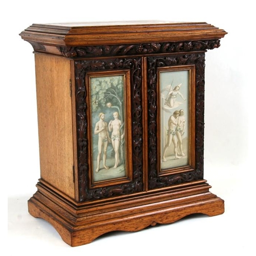 800 - A carved oak table cabinet, the pair of glazed doors decorated prints depicting Adam and Eve within ... 