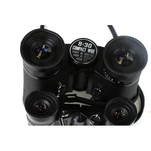 896 - A pair of Pentax 7x20 binoculars, cased; together with another similar pair, cased (2).