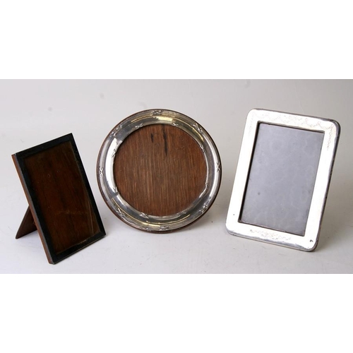 920 - Three silver photo frames.