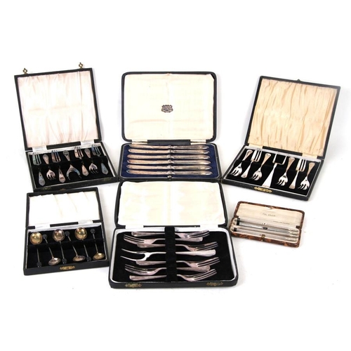 922 - A boxed set of silver coffee bean spoons; together with a set of silver handled butter knives, a box... 