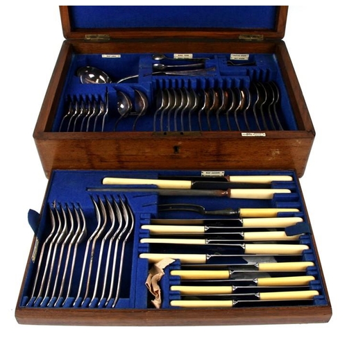 928 - A Walker & Hall oak cased canteen of silver plated cutlery.