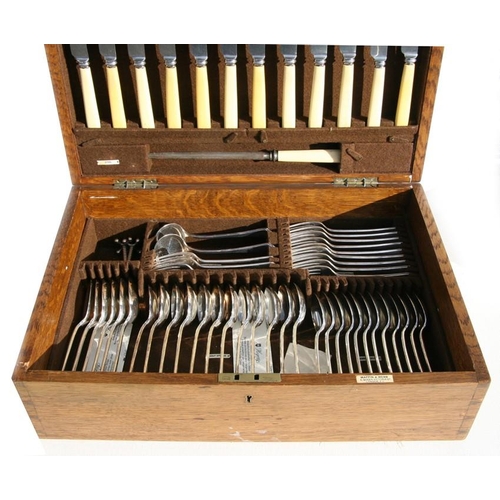 944 - An oak cased Mappin & Webb silver plated canteen of cutlery.Condition ReportMeat carvers and but... 